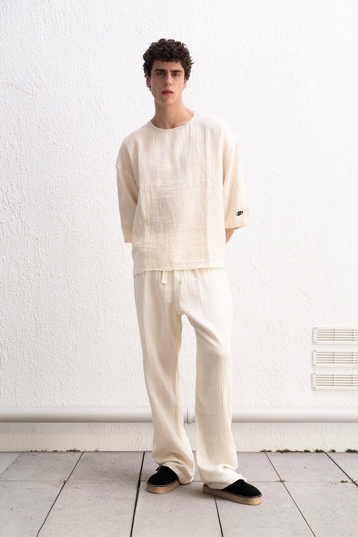 DRAPED LACE-UP BEIGE TROUSERS